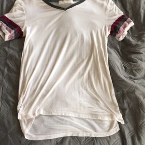 White shirt with purple and gray striped sleeves